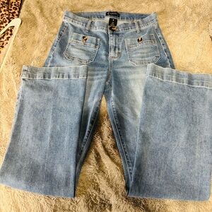 Nanette Lepore Light Blue Boot Cut Jeans, with button pocket detail.